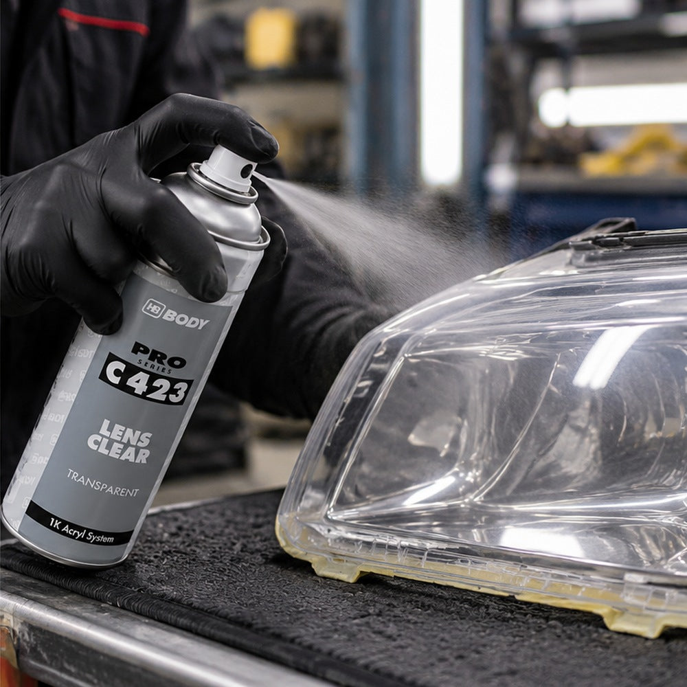 HB Body Lens Clear Headlight Restoration Spray 400ml spraying a headlight
